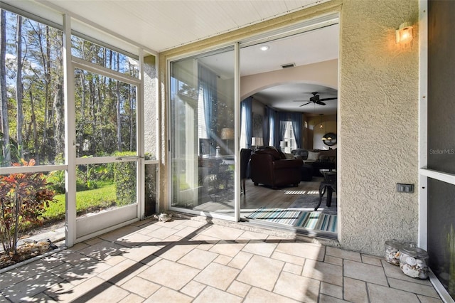 1687 Starling Dr, Tarpon Springs, FL 34689 - sunroom / solarium with ceiling fan and arched walkways