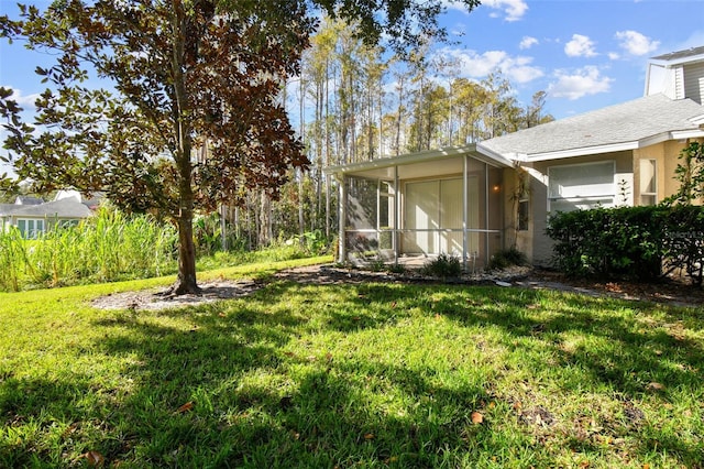 view of yard featuring a sunroom