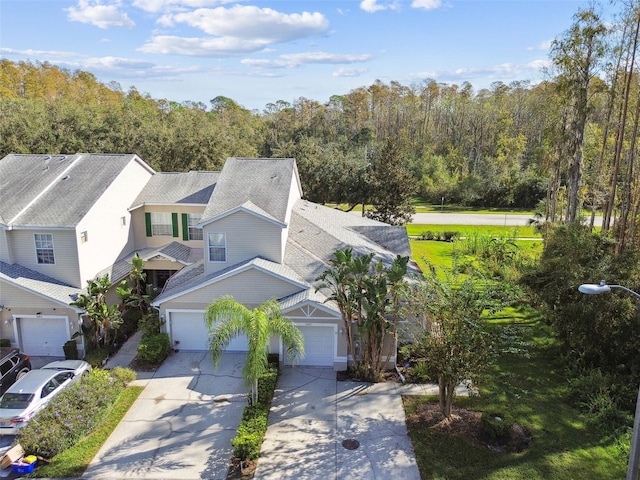 1687 Starling Dr, Tarpon Springs, FL 34689 - aerial view of property and surrounding area featuring a heavily wooded area