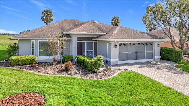 ranch-style house with a front lawn and a garage