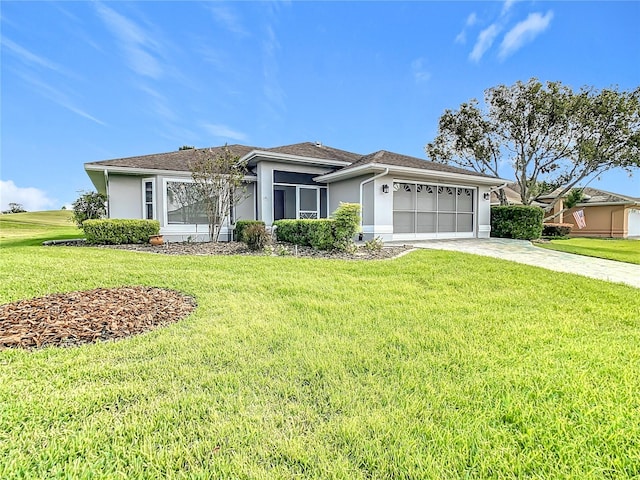 ranch-style house featuring a front yard and a garage