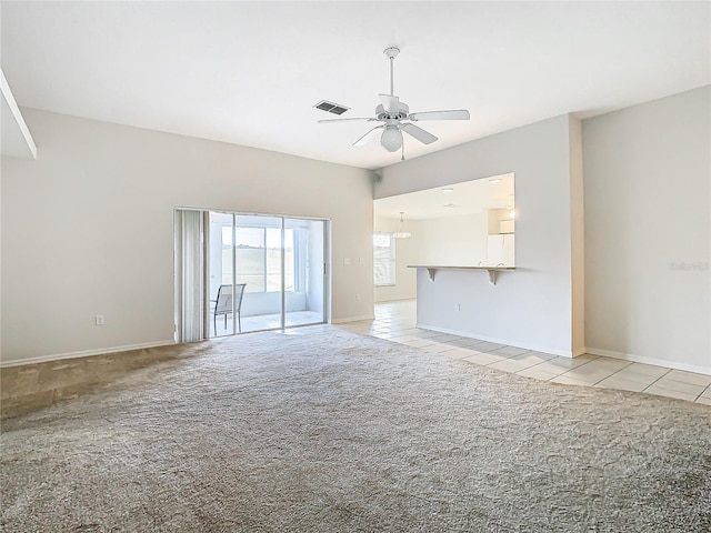 unfurnished living room featuring ceiling fan and light colored carpet