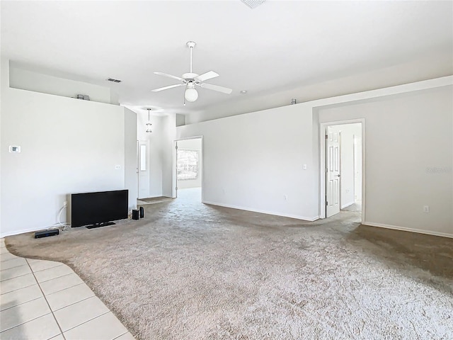 carpeted living room with ceiling fan