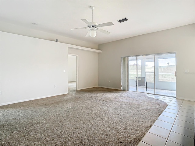 tiled empty room with ceiling fan