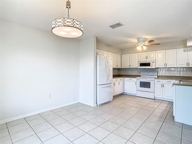 kitchen featuring white appliances, backsplash, hanging light fixtures, ceiling fan, and white cabinetry