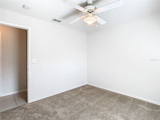 unfurnished room featuring carpet flooring and ceiling fan