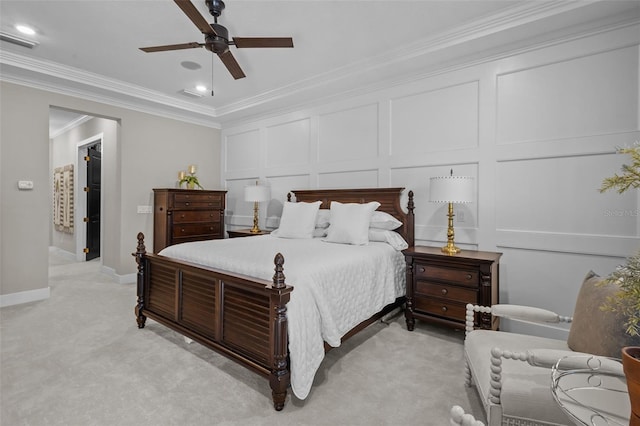 carpeted bedroom featuring ceiling fan and crown molding