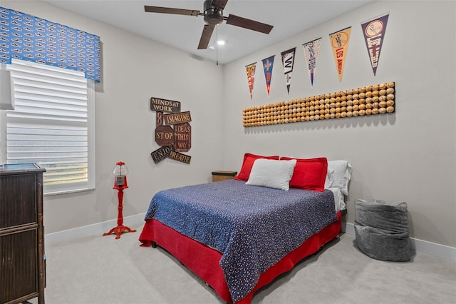 bedroom with ceiling fan and carpet floors