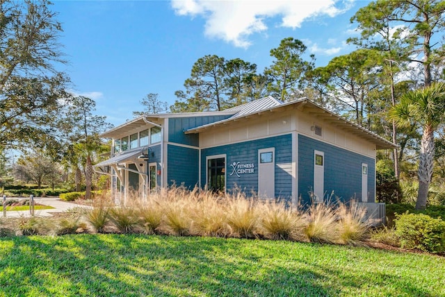 view of home's exterior featuring a yard