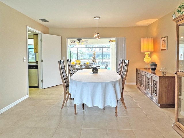 tiled dining room featuring ceiling fan