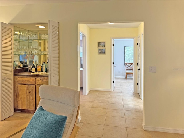 hallway with light tile patterned floors