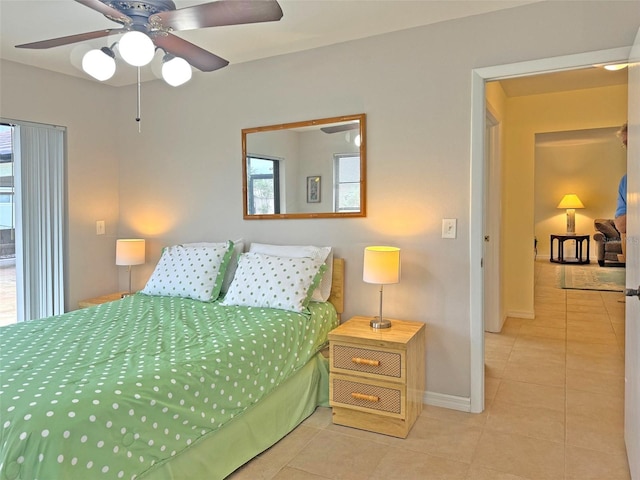 bedroom featuring ceiling fan and light tile patterned flooring