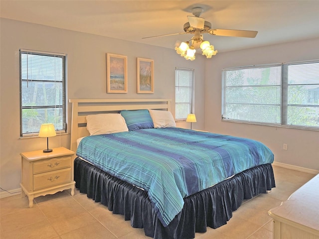 tiled bedroom with ceiling fan