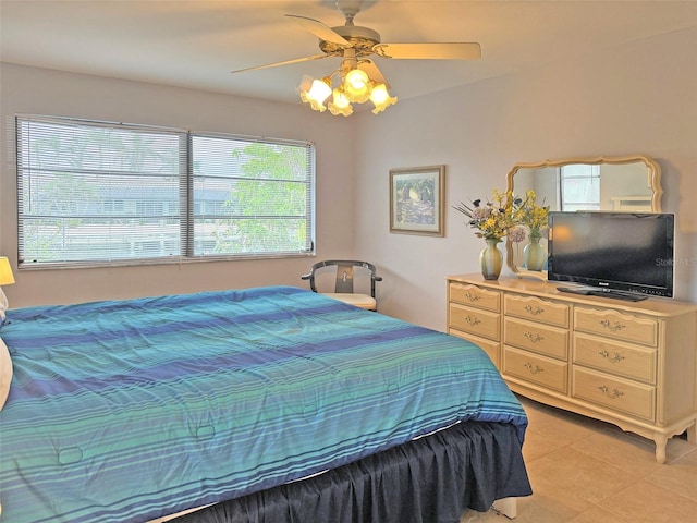 tiled bedroom with ceiling fan