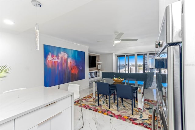 1390 Gulf Blvd Unit 1204, Clearwater, FL 33767 - dining room featuring marble look tiles and ceiling fan