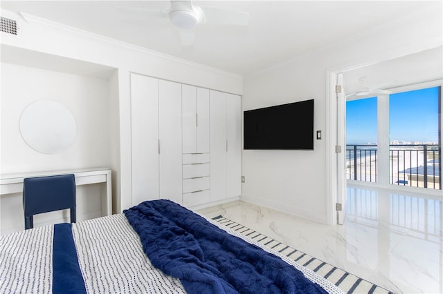 bedroom with a closet, ceiling fan, and crown molding