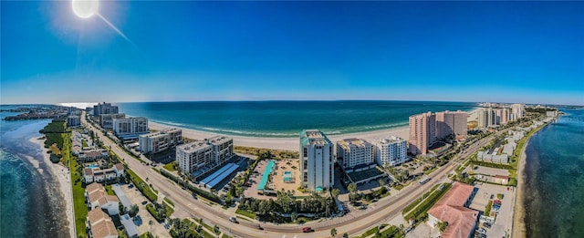 bird's eye view with a water view and a view of the beach