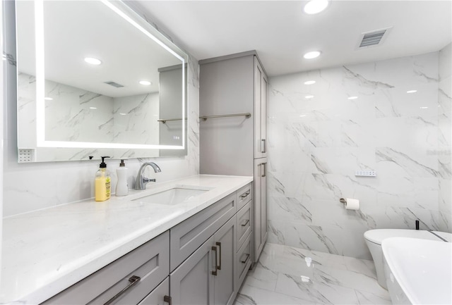 bathroom featuring vanity and toilet