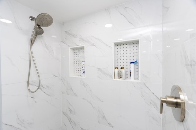 details with a tile shower