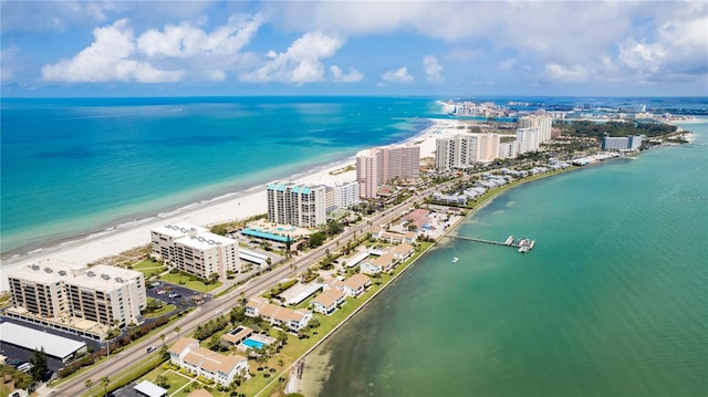 birds eye view of property featuring a view of the beach and a water view