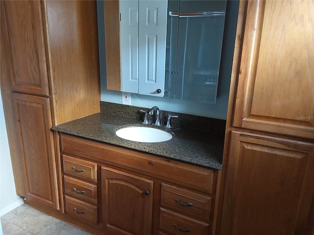 bathroom featuring tile patterned floors and vanity