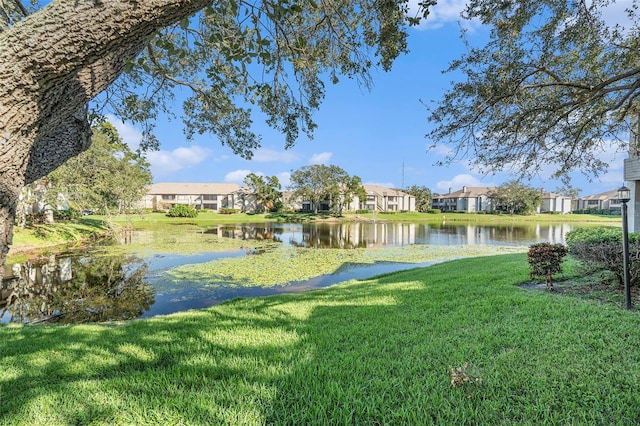 exterior space featuring a residential view and a water view