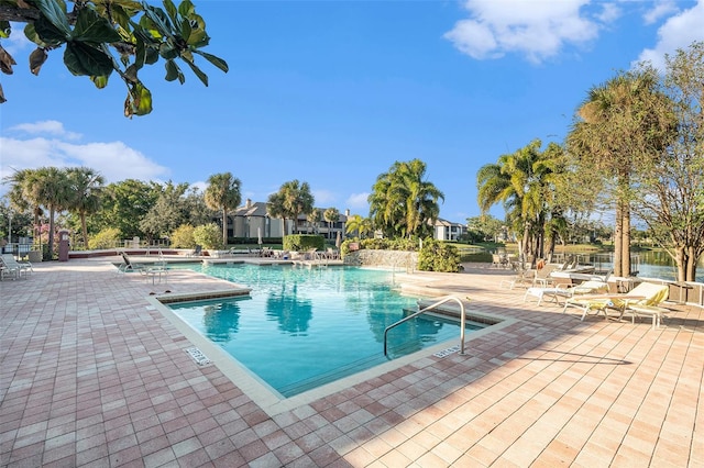 community pool with a patio area