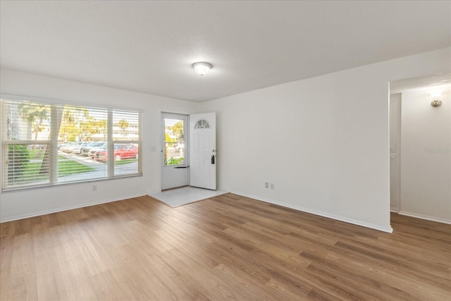 spare room with light wood-type flooring