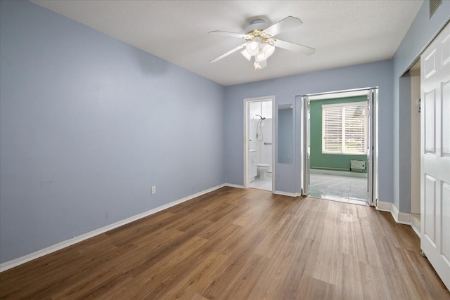 empty room with light hardwood / wood-style floors and ceiling fan