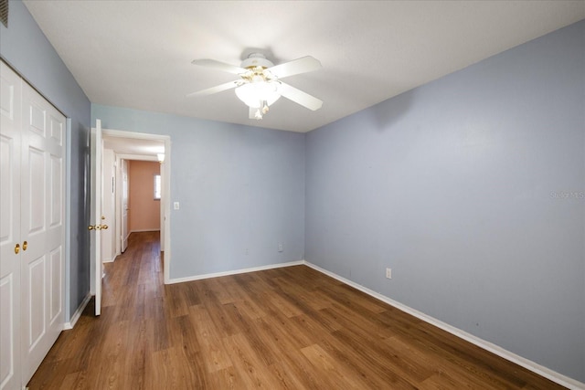 spare room featuring ceiling fan and hardwood / wood-style floors