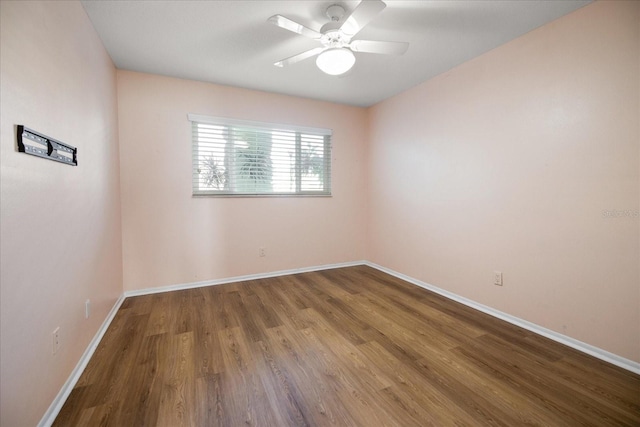 spare room featuring hardwood / wood-style floors and ceiling fan