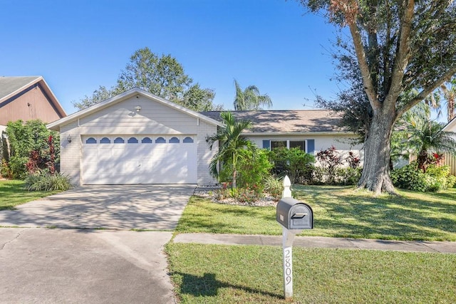 ranch-style house with a garage and a front yard