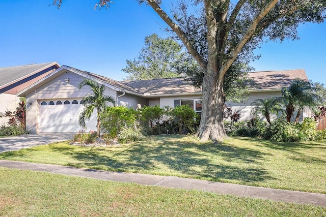 ranch-style home featuring a front yard and a garage