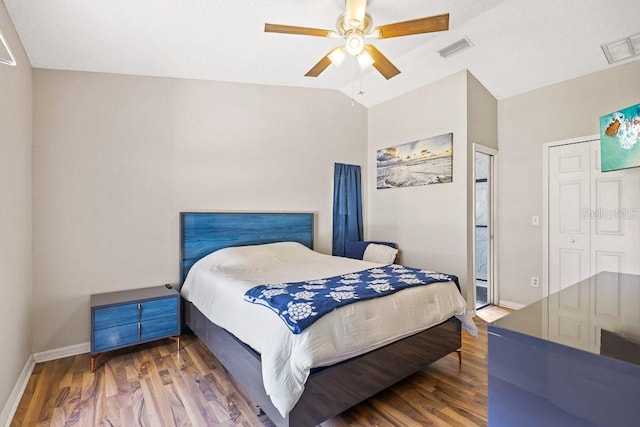 bedroom featuring ceiling fan, hardwood / wood-style floors, and lofted ceiling