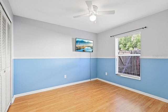 unfurnished room featuring hardwood / wood-style flooring and ceiling fan