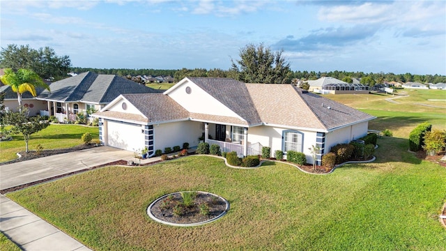 view of front of property with covered porch, a front yard, and a garage