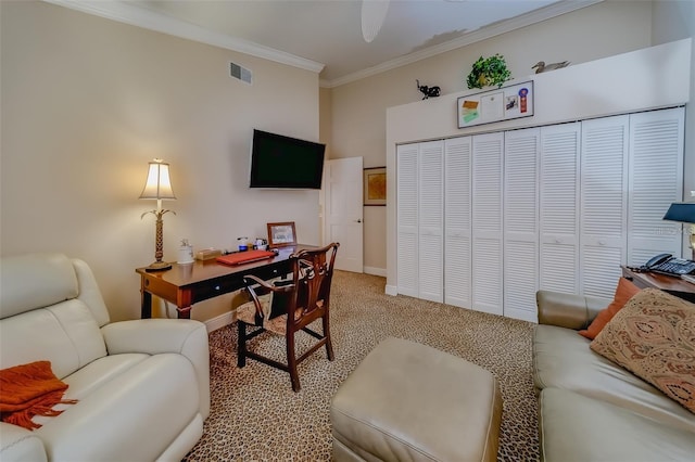 home office with light carpet and crown molding