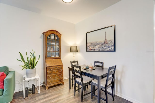 dining area with wood-type flooring