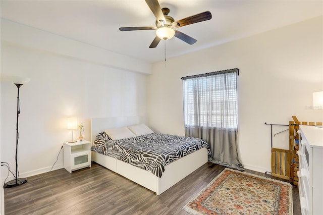 bedroom featuring dark hardwood / wood-style flooring and ceiling fan