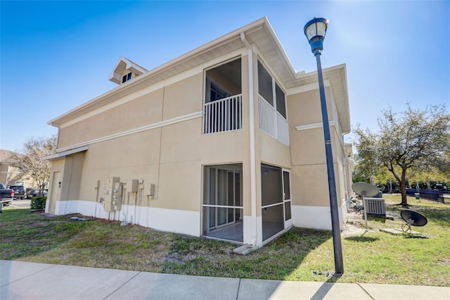 view of property exterior with a yard