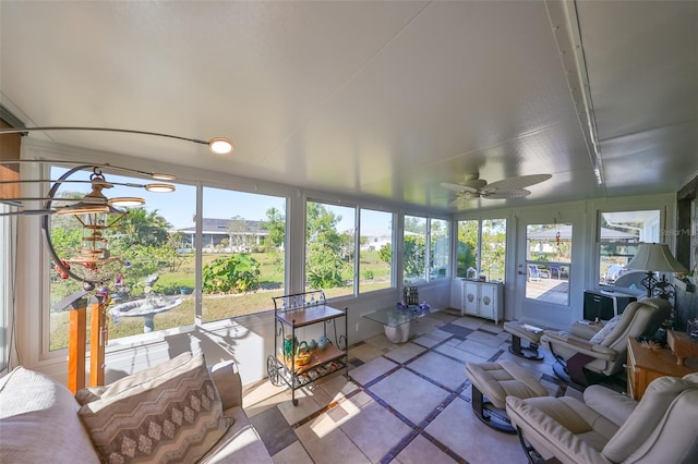 sunroom with ceiling fan and plenty of natural light