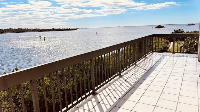 balcony featuring a water view