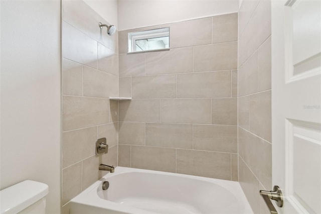 bathroom with toilet and shower / tub combination