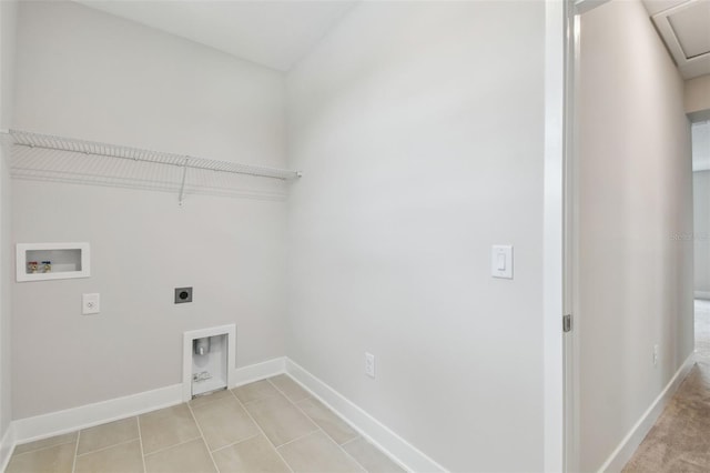 washroom featuring laundry area, baseboards, hookup for an electric dryer, washer hookup, and light tile patterned flooring