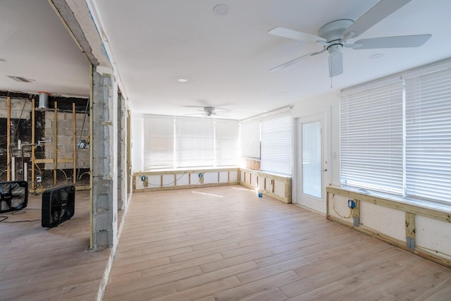 miscellaneous room with light hardwood / wood-style flooring and ceiling fan