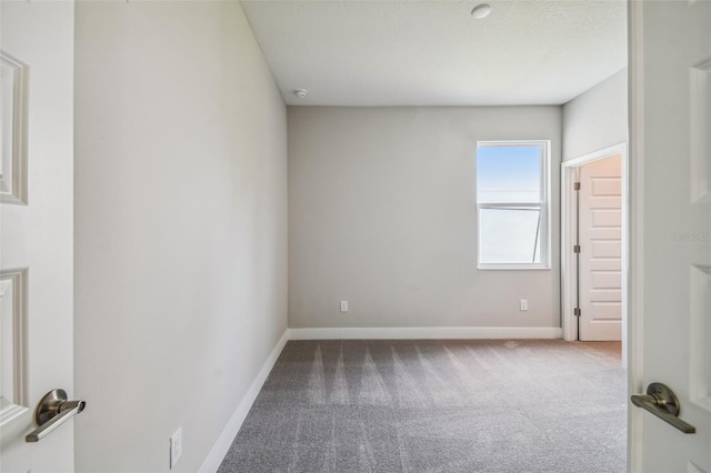 empty room featuring carpet flooring