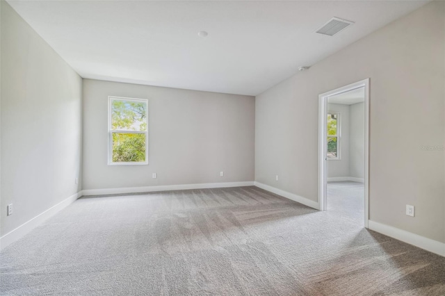 empty room featuring light colored carpet