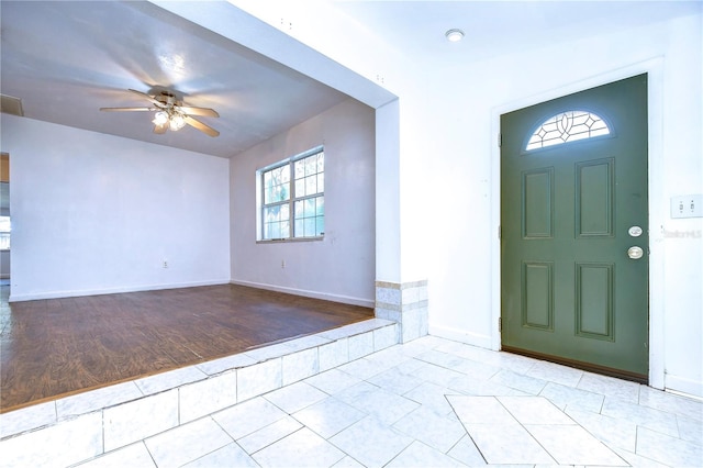 entryway featuring light wood-type flooring and ceiling fan