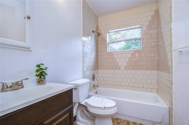 full bathroom featuring tiled shower / bath combo, toilet, and vanity