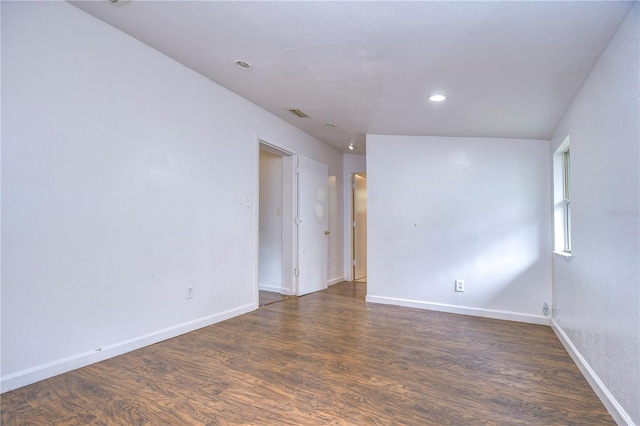 unfurnished room with dark hardwood / wood-style flooring